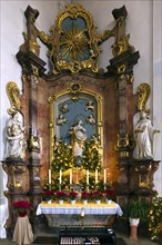 Altar of the Virgin Mary in the late Baroque St Bartholomews Church decorated for Christmas