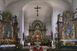 Altars of the late Baroque St Bartholomews Church decorated for Christmas