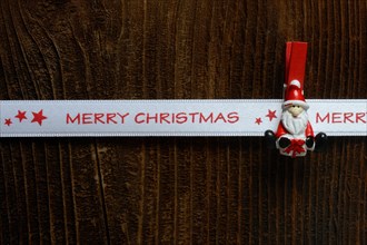 Father Christmas Clamp Holds Gift Ribbon