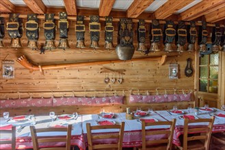Cow bells displayed in restaurant of mountain farm