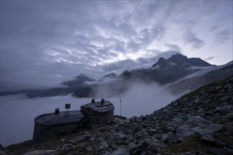 Chamanna Coaz mountain hut above the Val Rosegg valley at blue hour