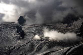 Bernina Group with Rosegg Glacier and dramatic clouds at blue hour