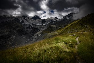 Bernina Group with Rosegg Glacier and dramatic clouds at blue hour