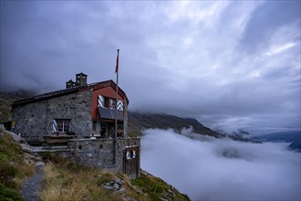 Chamanna Coaz mountain hut above the Val Rosegg valley at blue hour