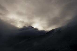 Bernina Group with Rosegg Glacier and dramatic clouds at blue hour
