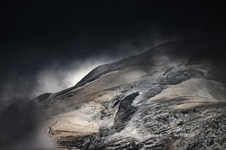 Bernina Group with Rosegg Glacier and dramatic clouds at blue hour