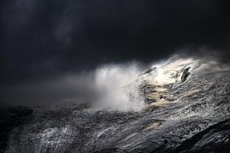 Bernina Group with Rosegg Glacier and dramatic clouds at blue hour