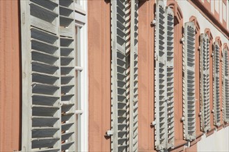 A row of shutters with louvres
