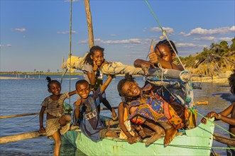 Children playing on a little sailing boat