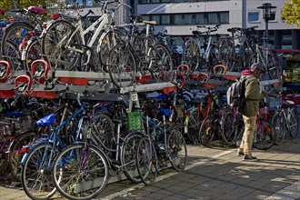 Very many bicycles at the parking spaces of the bike station at the main station