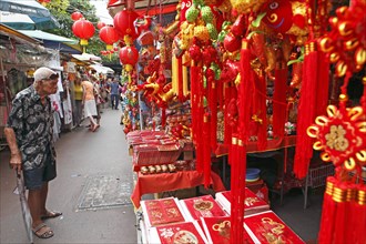 Red lamps and pendants in a market alley