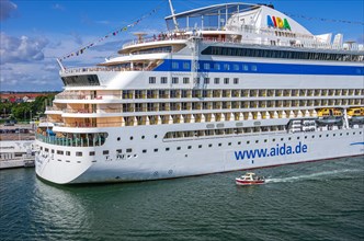 The cruise ship AIDAmar at the quay wall of the Warnemuende Cruise Center in the port of Rostock-Warnemuende