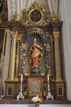 Altar of the Virgin Mary in the Baroque parish church of St. Oswald