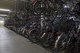 Very many bikes in the bike parking garage of the bike station at the main station
