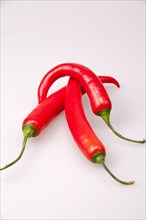 Three red chillies on top of each other