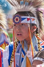 Young boy in traditional regalia at the T'suu Tina pow-wow