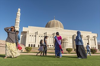 Indian family visiting Sultan Qaboos Grand Mosque