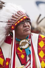 Native male elder in traditional regalia