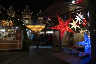A view of a small section of a Christmas market with items on sale. Coburg