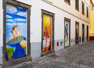 Alley with colourfully painted doors