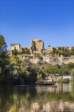 Excursion boat and canoe on the Dordogne and the Chateau de Beynac