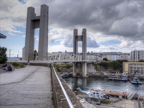 Largest vertical lift bridge in Europe in Brest 'Pont de Recouvrance' over the river Penfeld. A giant helicopter is on display under the bridge