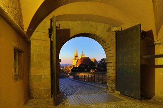 View through the Peterstor of the Petersberg Citadel of the Severi Church and Erfurt Cathedral at dawn