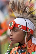 Young First Nations boy in traditional First Nations regalia