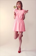 Woman in pink mini dress