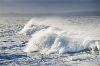 Large waves in the morning light on the open sea off the coast of Isle of Skye