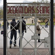 Visitors at the gate to the camp in the former beech forest concentration camp