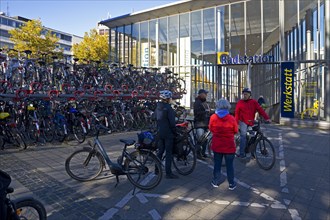 Very many bicycles at the parking spaces of the bike station at the main station
