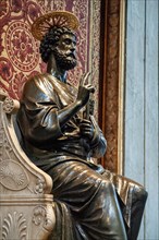 Statue of Saint Peter Bronze statue of Saint Peter with halo on marble throne