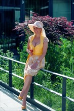 Elegant woman in dirndl and sun hat