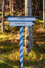 White-blue directional sign