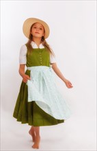 Dancing girl in dirndl with hat