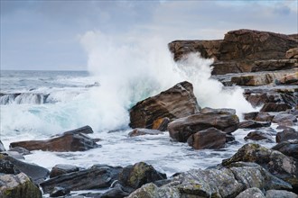 Water dashing against rocks on the rocky coast on Isle of Skye