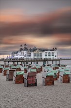 Pier and beach chairs on the beach of Sellin