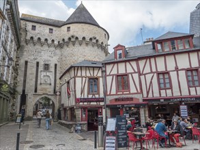 Half-timbered houses on Rue Francis Decker and entrance through the city wall Prison Gate in the old town