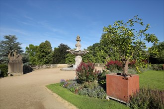 Spa park with ornamental fountain and sculpture in Bad Duerkheim