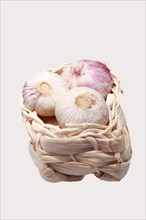Basket with French garlic bulbs