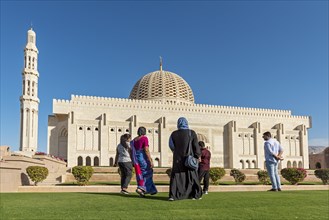 Indian family visiting Sultan Qaboos Grand Mosque