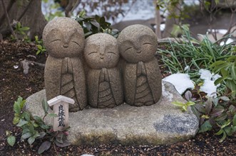 Three small stone buddhas