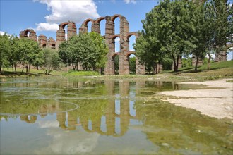 UNESCO Acueducto de los Milagros with reflection in the Rio Albarregas in Merida