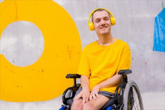 Disabled person in wheelchair listening to music