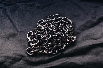 Roll of new metal chain found on the background