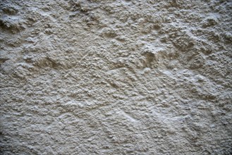 Rough plaster facade as texture or background