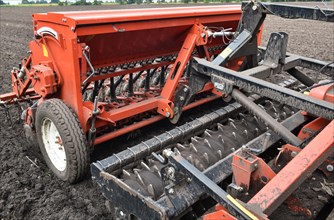 Harrow and seed drill on a tractor