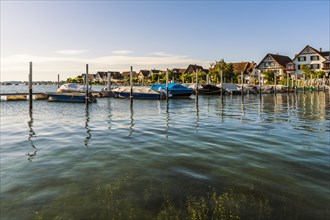 Boats and half-timbered houses at the harbour in Ermatingen on Lake Constance