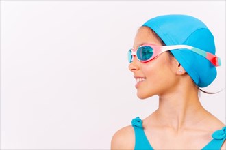 Portrait of girl with swimsuit and diving goggles for swimming lessons in the pool in summer. white background with copy space